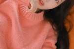 Beautiful girl in pink sweater mobile wallpaper