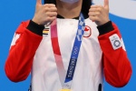 Chinese Canadian swimmer wins 100m butterfly