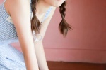 Photo of playful ponytail beauty in sexy suspender skirt