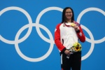 Chinese Canadian swimmer wins 100m butterfly