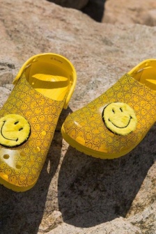 Crocs joint smiley face shoes displayed from multiple angles