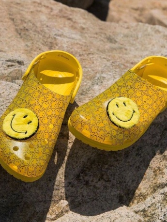 Crocs joint smiley face shoes displayed from multiple angles