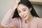 Shy and sweet photo of a beautiful student girl in the study room