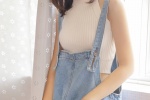 Aesthetic photo of a sunny and cute girl wearing suspenders and overalls