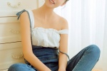 Sexy photo of a beautiful girl with round head and exposed shoulders