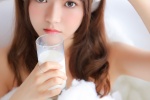Photos of beautiful girls drinking milk in bubble bath