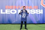 Messi shows off Paris team's new jersey photos
