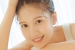Sexy photo of a beautiful girl with round head and exposed shoulders