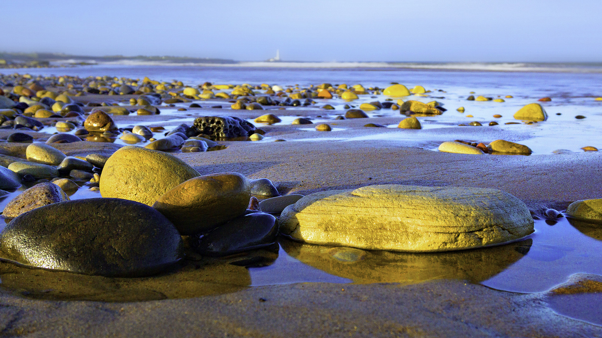 夕阳海浪海滩鹅卵石图片素材-编号04498149-图行天下