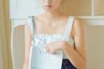 Sexy photo of a beautiful girl with round head and exposed shoulders