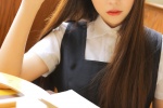 Seductive photo of beautiful girl in uniform in classroom