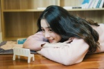 Shy and sweet photo of a beautiful student girl in the study room