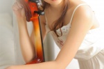 Elegant and sexy artistic photo of beautiful cello player