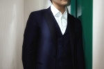 William Chan handsome photo of gentleman in dark blue suit