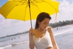 Fresh and sexy photo of a seaside beauty showing off her waist