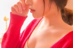Photo of sexy pretty girl in red cardigan and low-cut suspender belt