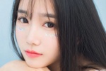 Temperamental long-haired beauty wet and seductive photo in bathtub
