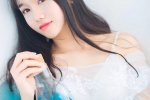 Temperamental long-haired beauty wet and seductive photo in bathtub