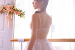 Elegant and sexy photo of beautiful woman with bare back dancing gauze skirt