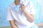 Sweet and seductive photo of short-haired beauty in uniform in classroom