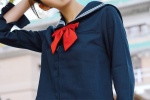 Seductive photo of college style beauty in navy uniform