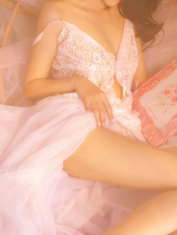 Photo of charming and sexy beauty with beautiful legs in suspender skirt