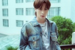 Zhang Yixing's handsome photo in washed blue retro denim outfit
