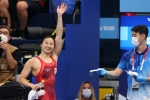 Chinese Canadian swimmer wins 100m butterfly