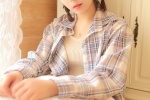 Beautiful photo of girl with single eyelids in plaid shirt