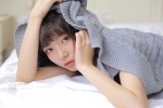 Sexy and charming photo of beautiful girl with beautiful legs on bed