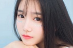 Temperamental long-haired beauty wet and seductive photo in bathtub