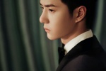 Wang Yibo's elegant and handsome photo in white shirt and black suit