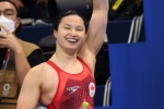 Chinese Canadian swimmer wins 100m butterfly