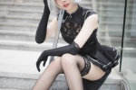 Sexy cos photo of cheongsam beauty with black stockings and beautiful legs
