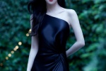 Jing Tian wears a black sloping shoulder dress in a hot and sexy photo