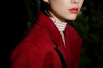 Charming photo of Li Sidani in burgundy coat