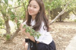 Beautiful girl in amusement park, sexy girl in miniskirt and uniform