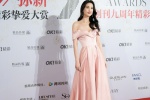 Huang Shengyi sexy photo in cherry blossom pink tube top dress