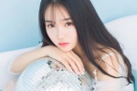 Temperamental long-haired beauty wet and seductive photo in bathtub