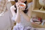 Seductive photo of beauty in polka dot dress with suspenders and long legs