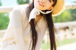 Beautiful and fresh outdoor photo of girl wearing straw hat