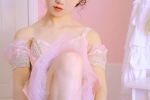 Beautiful photo of dance teacher in pink suspender gauze skirt