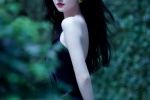 Jing Tian wears a black sloping shoulder dress in a hot and sexy photo