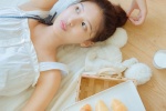 Sexy photo of a beautiful girl with round head and exposed shoulders
