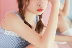 Photo of playful ponytail beauty in sexy suspender skirt