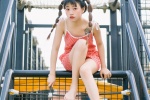 Cute and playful photo of girl with playful ponytail in amusement park